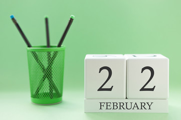 Desk calendar of two cubes for February 22