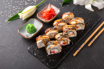 Unagi roll with smoked eel, with royal shrimp avocado, cream with Philadelphia cheese, tobiko caviar. Sushi menu. Japanese food. 