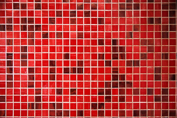 Light red and dark red glass tiles as modern finishing material. Abstract geometric background on...