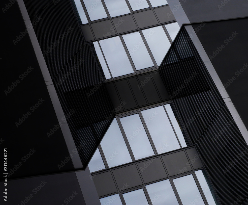 Poster digitally rendered image of industrial or office building fragments. glass and metal. wall panels an