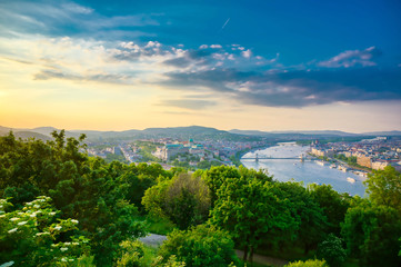 A view along the Danube River of Budapest, Hungary from Gellert Hill at sunset.