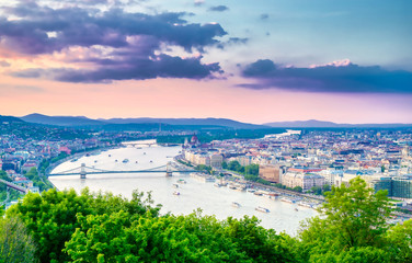 Fototapeta na wymiar A view along the Danube River of Budapest, Hungary from Gellert Hill at sunset.