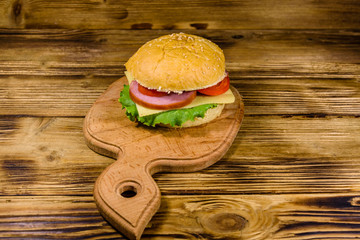 Fresh hamburger on the wooden cutting board