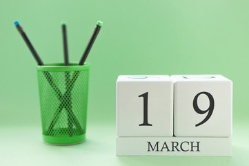 Desk calendar of two cubes for March 19