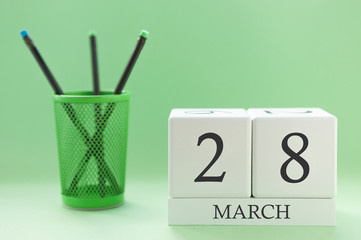 Desk calendar of two cubes for March 28