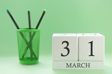 Desk calendar of two cubes for March 31