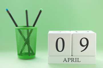 Desk calendar of two cubes for April 9
