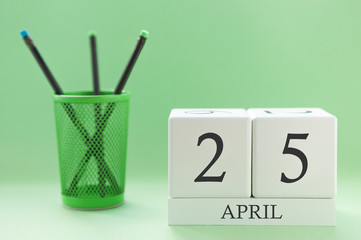 Desk calendar of two cubes for April 25