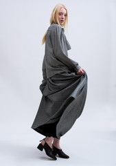 Naklejka premium Fashion shooting in studio . Professional model , fashionable clothes and style, new collection. stylish look.