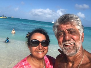 Middle Eastern couple taking selfies in the Caribbean