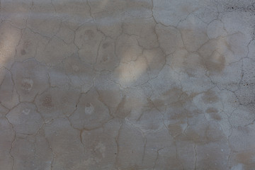 SURFACE OF GRAY AND CRACKET CEMENT, BACKGROUND