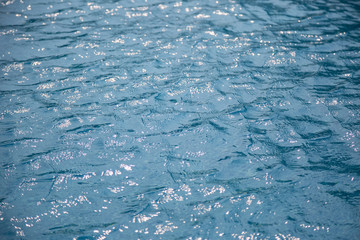 Blue water surface in the swimming pool