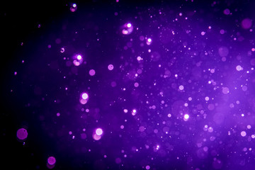 Abstract purple , violet bokeh on black