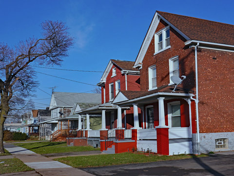 Street of older detached houses with gables and porches