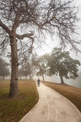 Brownwood Tx fog in the Riverside Park lake  winter season person 