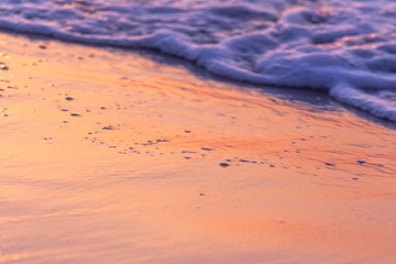 Abstract drawings on the water during sunset