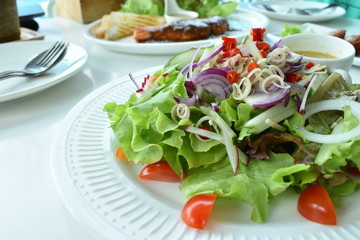 fresh salad on a white plate
