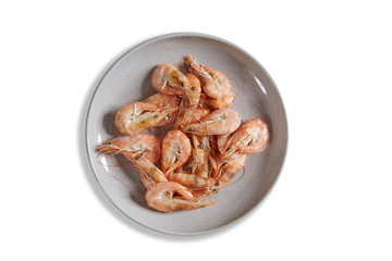 Boiled fresh shrimp on a plate isolated on white background