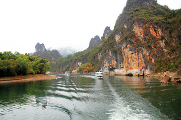 Fototapeta na wymiar Cruise ship travels the route along the Li river from Guilin to Yangshou,China