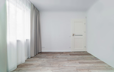 Apartment window in a multi-storey house white room
