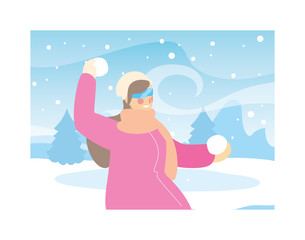 woman with winter clothes in landscape with snowfall