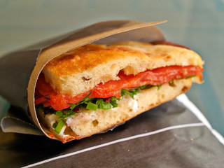 Smoked salmon sandwich with vegetables and freshly baked bread