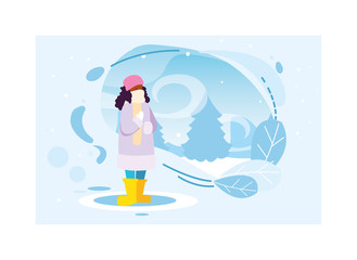 woman with winter clothes in landscape with snowfall