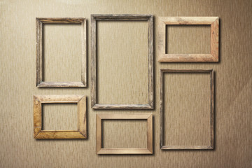 old photo frames on retro wallpaper