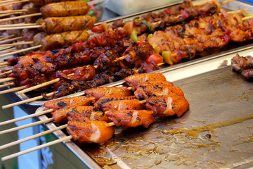 Grilled chicken with sauce, popular street food always found in Bangkok, Thailand and have space for write wording. Unhealthy food from dirt and carcinogen cause of cancer. Buy and eat carefully