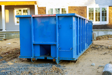 Recycling container trash dumpsters being full with garbage