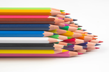 Colored pencils for drawing on a white background. Education and creativity. Leisure and art