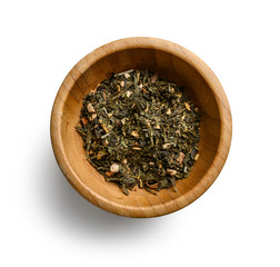 Green tea with aromatic additives. Top view on white background