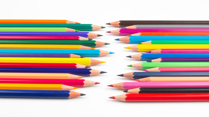 Fototapeta premium Colored pencils for drawing on a white background. Education and creativity. Leisure and art