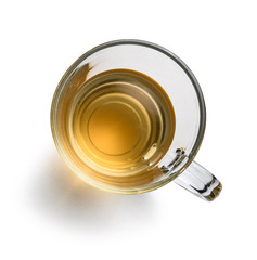 Tea in a glass mug on a white background. The view from the top