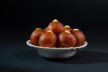 Gulab Jamun, Indian dessert topped with pistachio