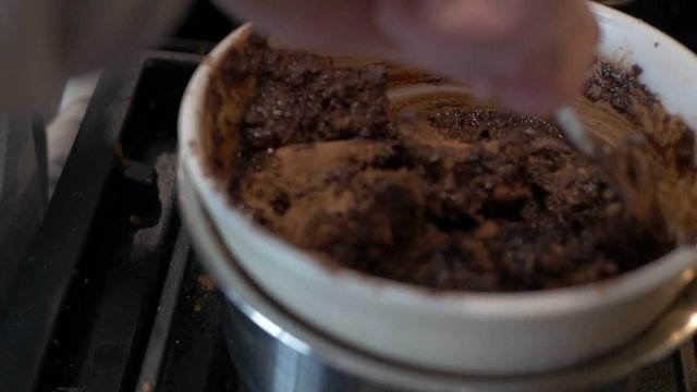 Close upcooking, chocolate ingredients melting for vegan brownies