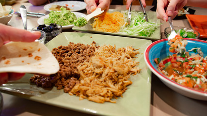 Group of people eating taco dinner