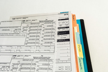 Obraz premium File Binders with Documents to prepare canadian Tax Returns