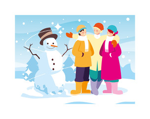 group of people with snowman in winter landscape