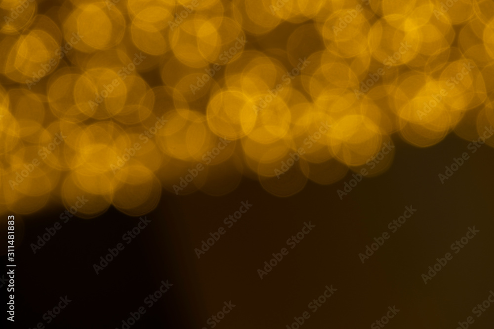 Wall mural defocused of blurred golden bokeh circle light from lighting bulb merry christmas and happy new year