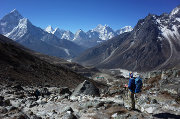 Everest trek, Hiker is enjoying the view of Himalayas with Ama Dablam mountain. Sagarmatha national park, Solukhumbu, Nepal