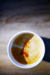 Hot coffee on a wooden background