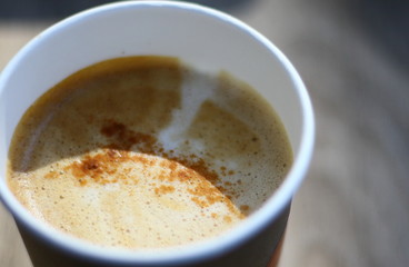 Hot coffee on a wooden background
