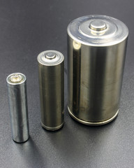 set of batteries on black background