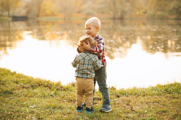 Happy little brothers enjoying time together and having fun