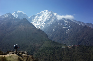 Fototapeta na wymiar Everest trek, Tourist is standing on Pangboche - Portse upper trail with view of Tengboche village. Mountains Himalayas, Sagarmatha national park, Solukhumbu, Nepal
