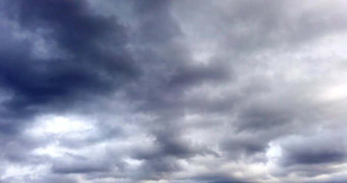 Dramatic storm dark rainy clouds moving over the sky. Stormy and rainy weather. Timelapse 4K footage