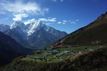 Hiking in Nepal Himalayas, Amazing view of Dhole village (4200 m) with Thamserku mountain. Trail...