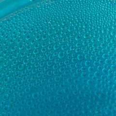 Blue water drops background close up