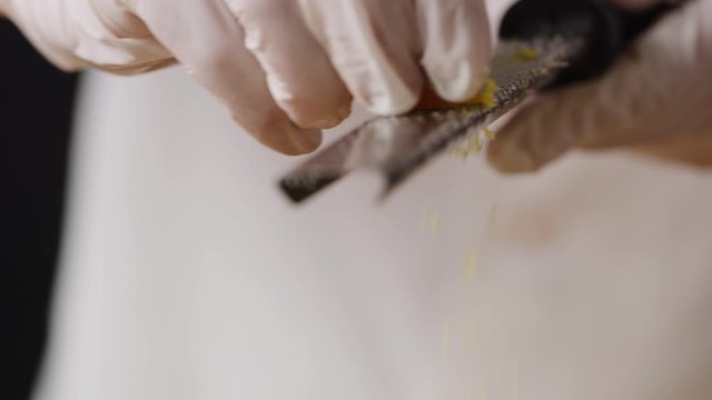 Grate lemon rind on beef Tar Tar macro, five star meal, Michelin recipe,  slow motion, shot on Red Weapon Helium